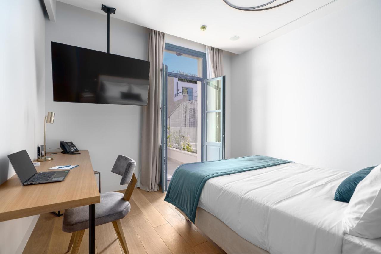 Hellenic Vibes Smart Hotel Atenas Exterior foto A room at the hotel