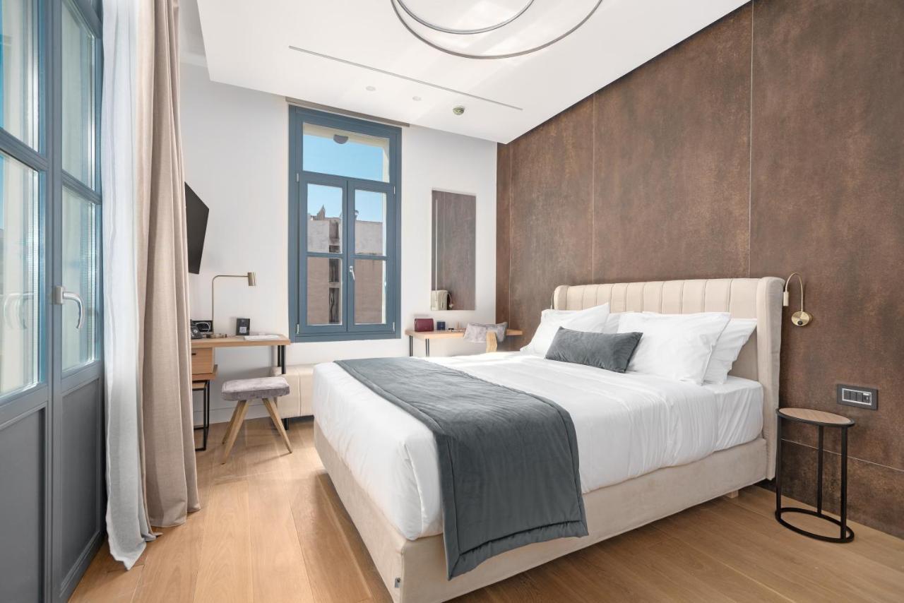 Hellenic Vibes Smart Hotel Atenas Exterior foto A bedroom at the hotel