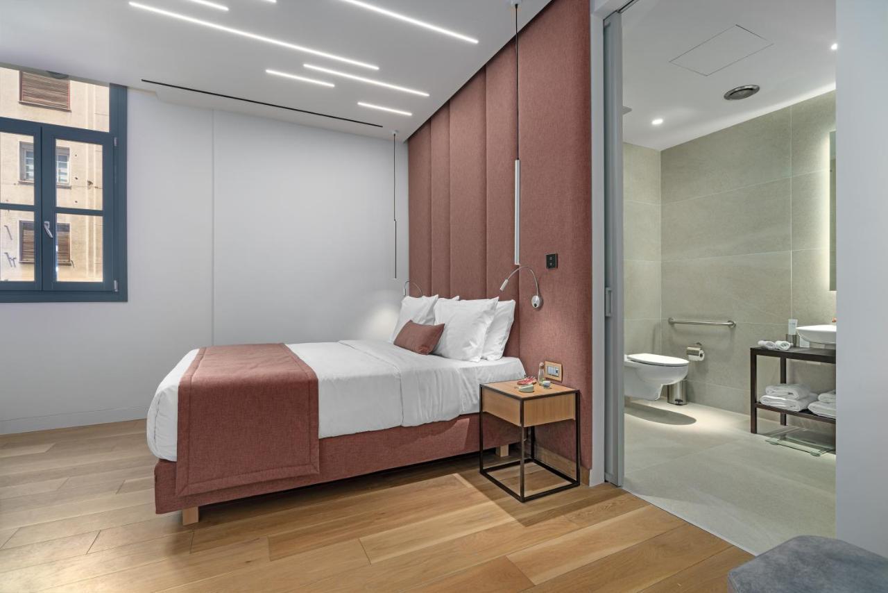 Hellenic Vibes Smart Hotel Atenas Exterior foto A bedroom at the hotel