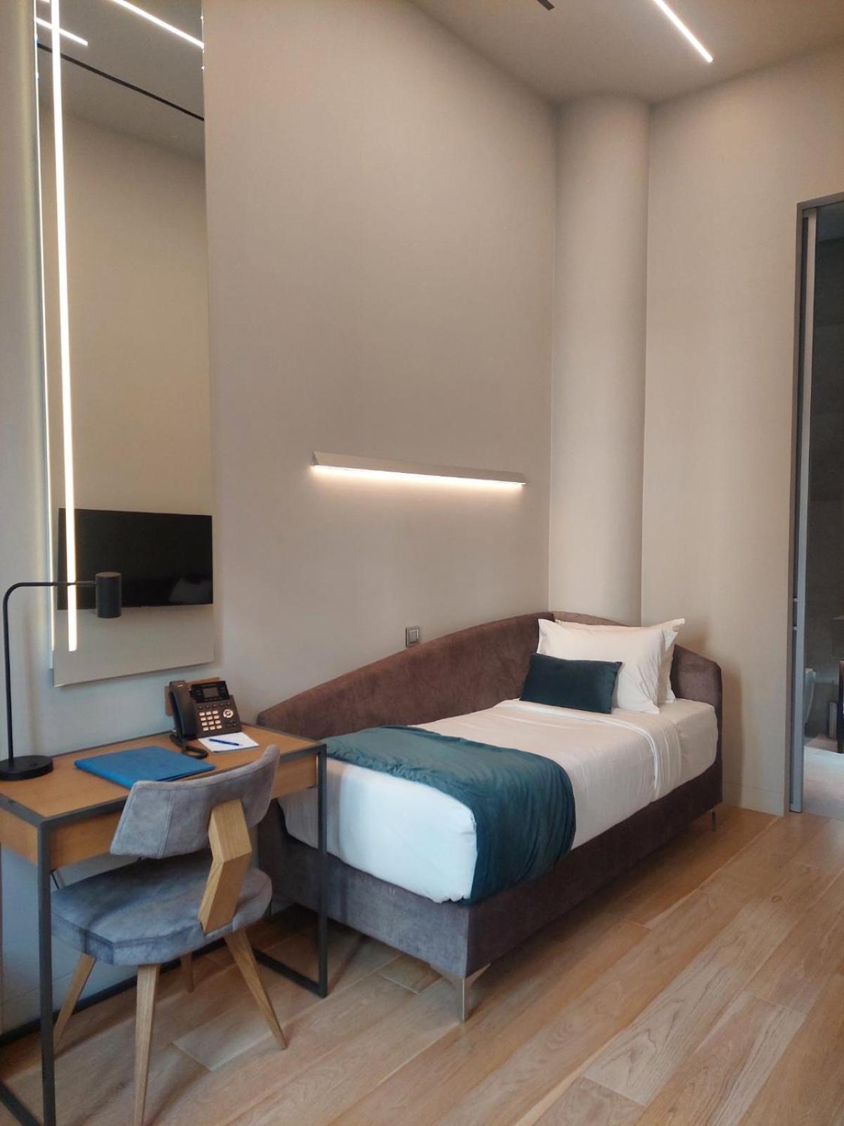 Hellenic Vibes Smart Hotel Atenas Quarto foto A room at the hotel